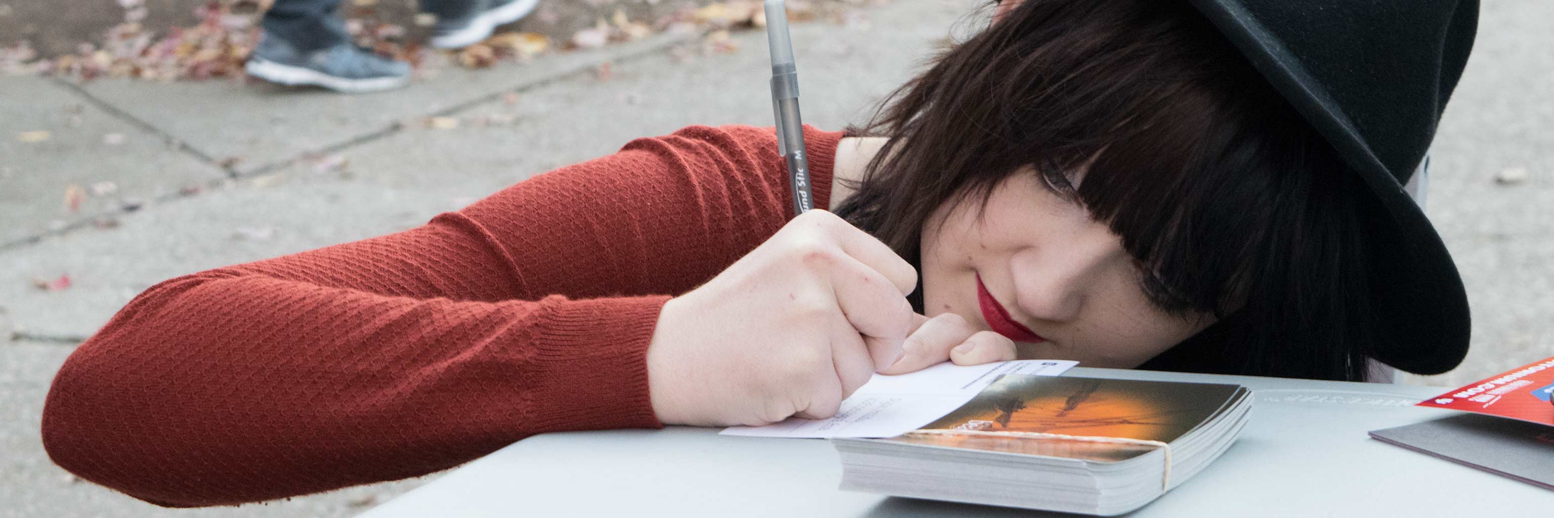 Girl writing on a piece of paper