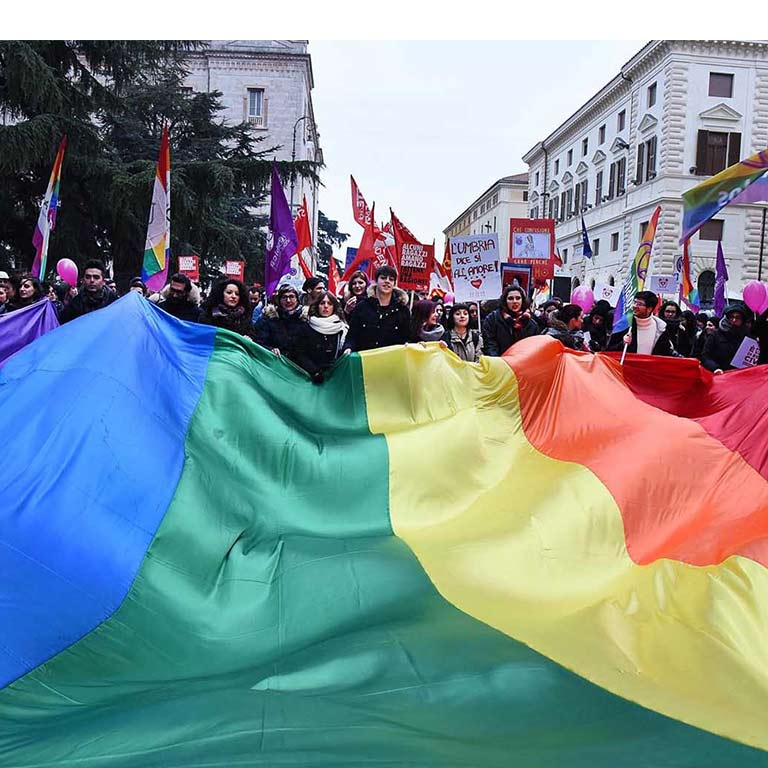 gay pride march with flags